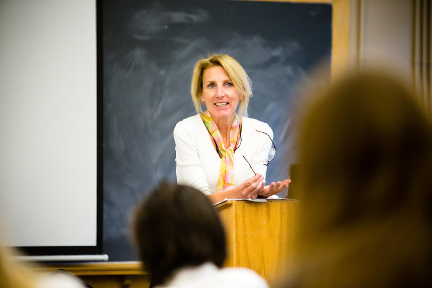 Instructor in front of classroom at podium