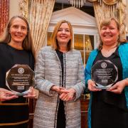 Susan Fouts, Marie Royce, Assistant Secretary of State for Education and Cultural Affairs, and Cheryl Ernst stand with their awards.
