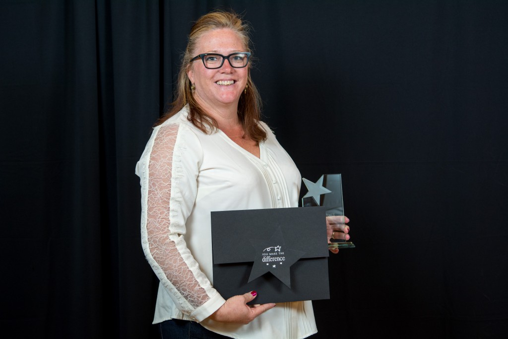 Image of Jennifer Burnham holding her award.